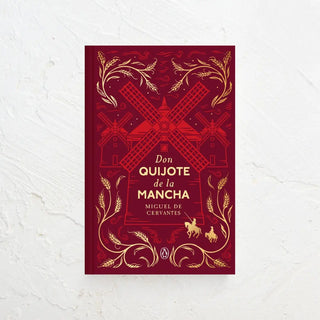 Don Quijote de la Mancha. Una edición conmemorativa en cuya portada aparecen tres molinos con el ondo burdeos. Real Fábrica