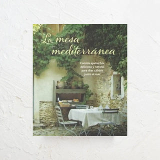 libro de recetas de cocina mediterránea en cuya portada vemos una mesa al estilo mediterráneo. Real Fábrica