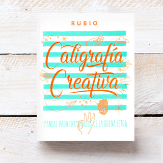 Libro Caligrafía Creativa Rubio. Portada lettering con dibujos. Real Fábrica.