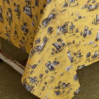 Detalle de las imágenes del mantel de la colección Quijote en color amarillo. Real Fábrica