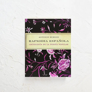 Libro de poesía popular cuya portada tiene fonda negro y flores en rosa. Real Fábrica