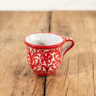 Taza de café solo de cerámica de Granada con dibujo tradicional del pájaro en color rojo. Real Fábrica